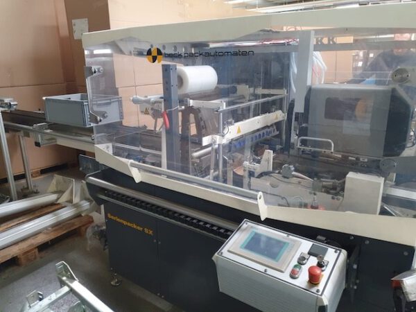Taktende Folienverpackungsmaschine, Beck mit Zusatzdrucker