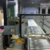 Packstraße mit unangetriebener Fördertechnik, integrierte Waage, eine Umreifungsmaschine und Druckvorrichtung – gebraucht - :
