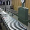 Packstraße mit unangetriebener Fördertechnik, integrierte Waage, eine Umreifungsmaschine und Druckvorrichtung – gebraucht - : – Bild 3